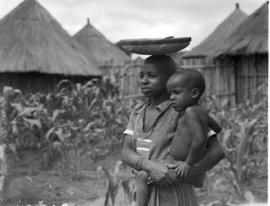 Tzaneen district, 1951. Mother and child in village.