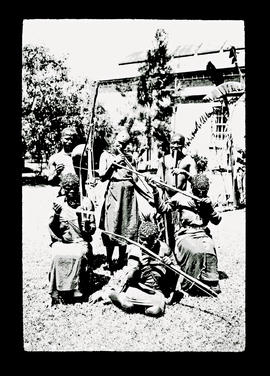 Black musicians with traditional instruments.