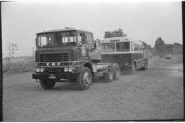 Johannesburg. SAR International Harvester combination bus and truck No MT15643 being towed by SAR...