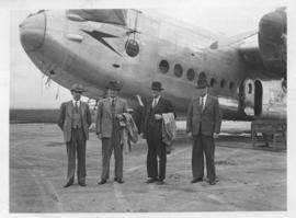 Four men with Avro York. Note "Speedbird" emblem on nose.