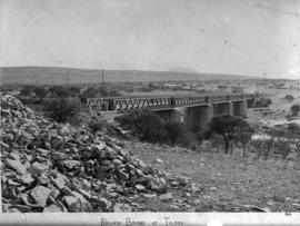 Tylden, 1895. Bridge over river with stone piers and seven spans.