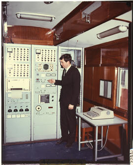 Mechanical engineer at large control panel.