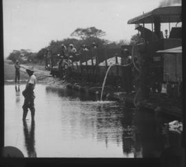 Naboomspruit, 1924. Dutton roadrail tractor on low-level bridge over the Nyl River.