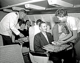 
SAA Boeing 707 interior. Meals served. Hostess and steward.
