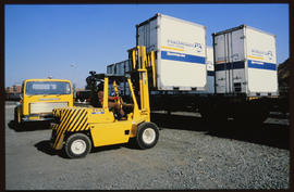 
Forklift loading container.
