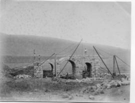 Circa 1893. Small bridge being constructed.