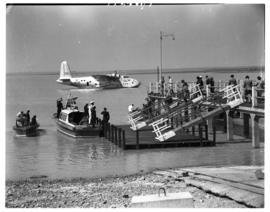 Vaal Dam, circa 1948. BOAC Solent flying boat G-AKCR 'Saint Andrew'. Passengers on their way to p...