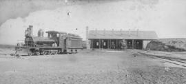 Burgersdorp, 1895. CGR 4th Class 'Conv Joys' with Baldwin built CGR 1st Class 2-6-0 on right of s...