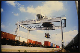 
Container crane gantry lifting railway bogies.
