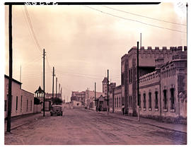 Swakopmund, South-West Africa, 1952. Street, old German barracks on right.