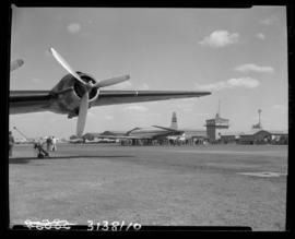 Johannesburg, July 1951. Palmietfontein. Airport buildings and tower from under Douglas DC-4 wing...