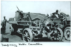 Circa 1915. Lorry engine with temporary water connections from external water tank to the engine ...