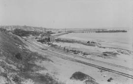 Port Elizabeth. View of railway lines along the coast, with the South (closest) and North Jetties...