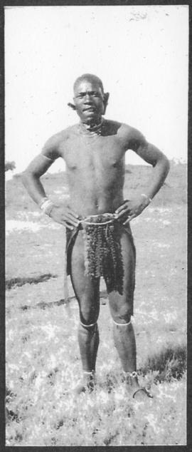 Circa 1925. Black male in traditional dress. (Album on Natal electrification)