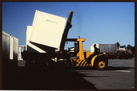
Forklift loading containers.
