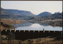 
Small dam with concrete wall.
