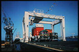 Durban, November 1971. Containers being loaded on SAR Foden trucks on 'Voorloper'. [V Gilroy]