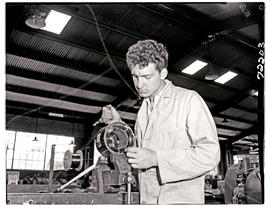 "Johannesburg, 1962. Apprentice with armature winder at SAR Road Transport Services workshop...