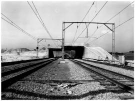 Johannesburg, September 1956. Bridge over four railway tracks at Crown, with mine dumps in the ba...