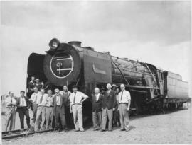 Group of men posing at SAR Class 23 named "Port Elizabeth".