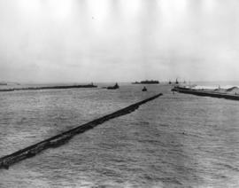 Durban, circa 1938. Arrival of floating dock at entrance to Durban Harbour.