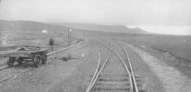 Gaika, 1895. Railway lines with trolley at station. (EH Short)