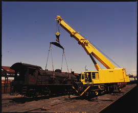 February 1982. Gottswald 85 tonne breakdown crane lifting SAR Class 12 No 1503. [D Dannhauser]