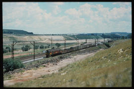 Johannesburg, 1981. Goods train passing mine dump.