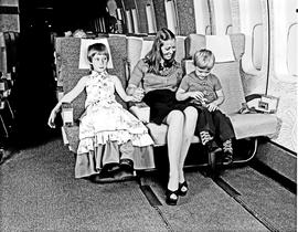 
SAA Boeing 747 interior. Mother and young girl and boy.
