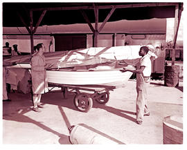 "Nelspruit, 1975. Boat on trailer at railway station."