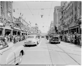 Durban, 22 March 1947.  Royal family in open car in the city centre, past Stuttafords and OK Baza...