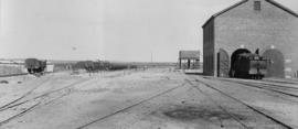 De Aar, 1895. Station yard, building and water tank in the distance. (EH Short)