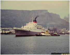 Cape Town, December 1966. 'Windsor Castle' assisted by tug 'FT Bates' in Table Bay harbour. [HT H...