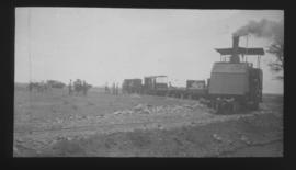 Dutton roadrail tractor with goods trucks.