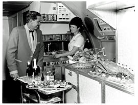 
SAA Boeing 707 interior. Cabin service. Steward and hostess. Lobster. Galley.

