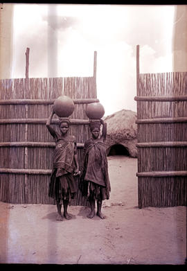 "Swaziland, 1933. Swazi women carrying pots."