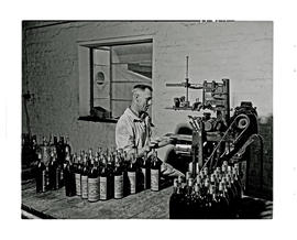 Paarl, 1945. KWV distillery. Sticking labels to bottles.