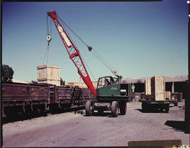 January 1968. Mobile crane loading wooden box on SAR wagon. [S Matthysen]