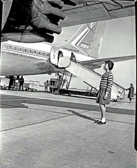 
SAA Boeing 707. Young girl looking at engine.
