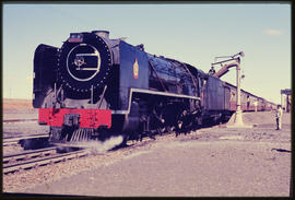 Virginia. SAR Class 23 'Vrystaat' taking water at railway station.