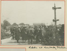 Kimberley, circa 1915. Captured rebels next to railway signal post.