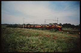 Pretoria, 1974. Three SAR Class 6EI Srs 4's with lead engine No E1498 delivering a train of SAR C...