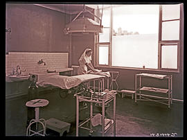 Springs, 1940. Nurse preparing hospital operating theatre.