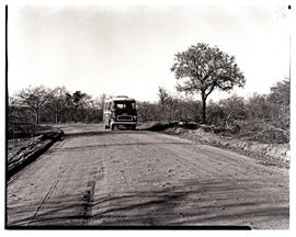 Kruger National Park, 1962. SAR Chevrolet motor coach No MT6919 on gravel road.