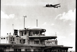Johannesburg, 1946. Rand airport. SAA Junkers Ju-86 in flight over control tower.
