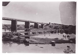 Circa 1900. Anglo-Boer War. Temporary bridge Modder River from south and east. Coaches on main li...