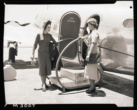 Johannesburg, January 1951. Palmietfontein Airport. Woman modelling for “Milady” next to SAA Lock...