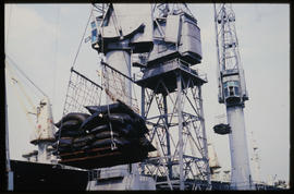 Durban, September 1984. Crane loading bags in Durban Harbour. [T Robberts]