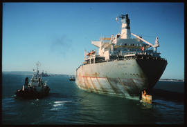 Saldanha, August 1977. Ore carrier 'Hoegh Hill' with SAR tug in Saldanha Bay Harbour. {CJ Dannhau...