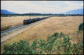 
Passenger train in single track in open country.
